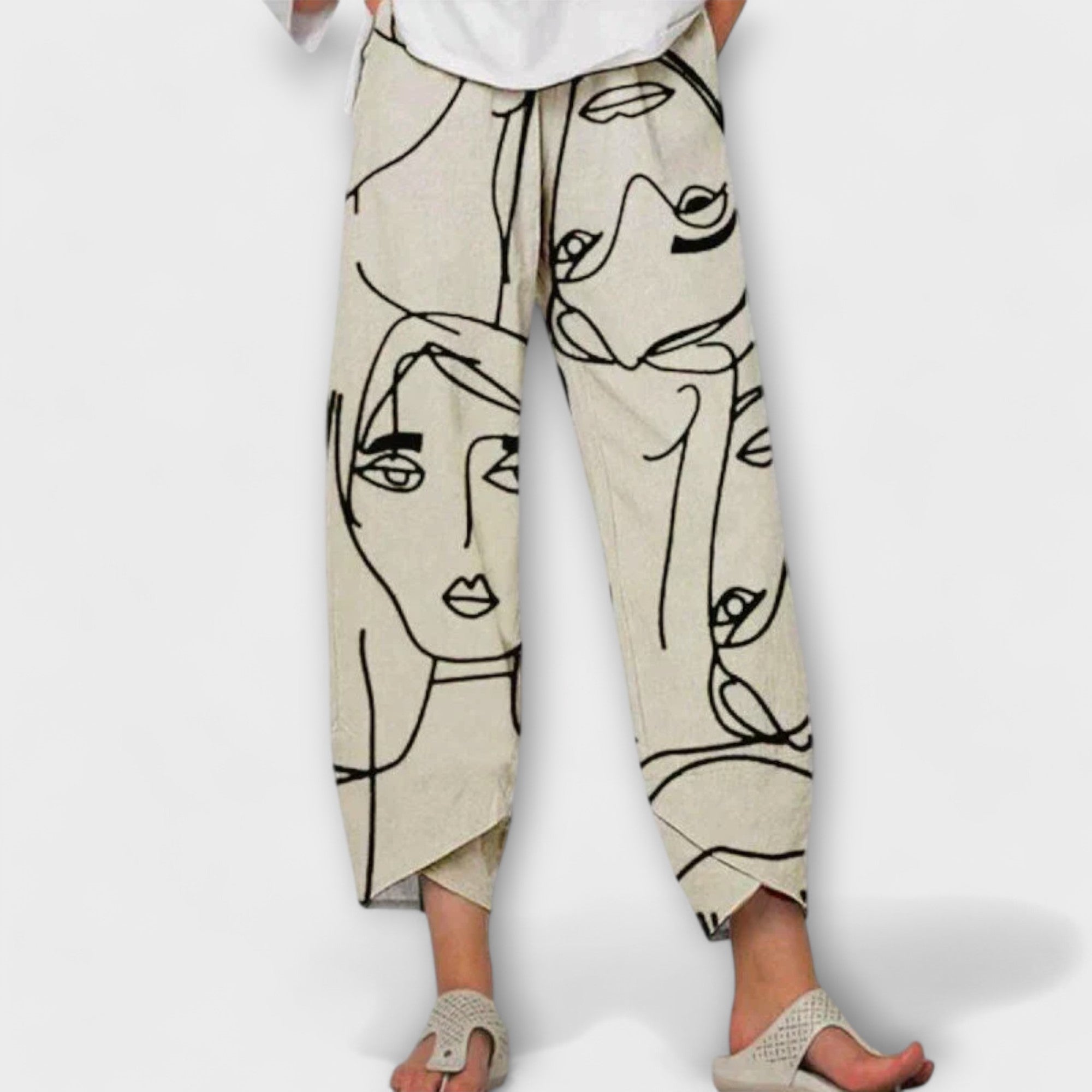 NAHIA | Pants with artistic face print