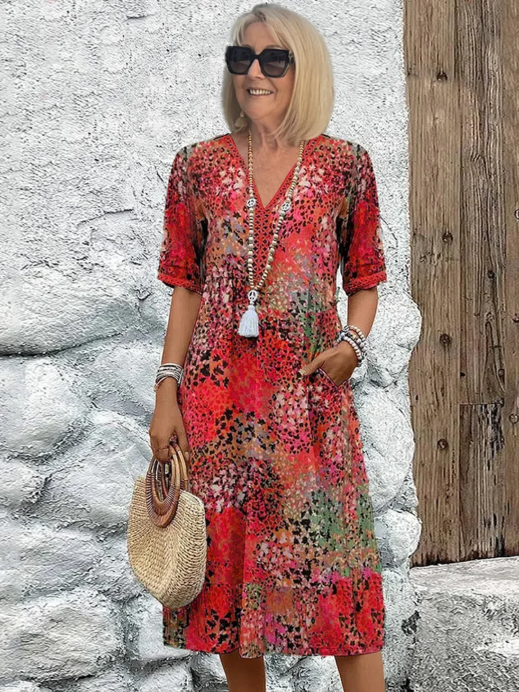 FLORENCIA | Sleeveless midi dress with vibrant print