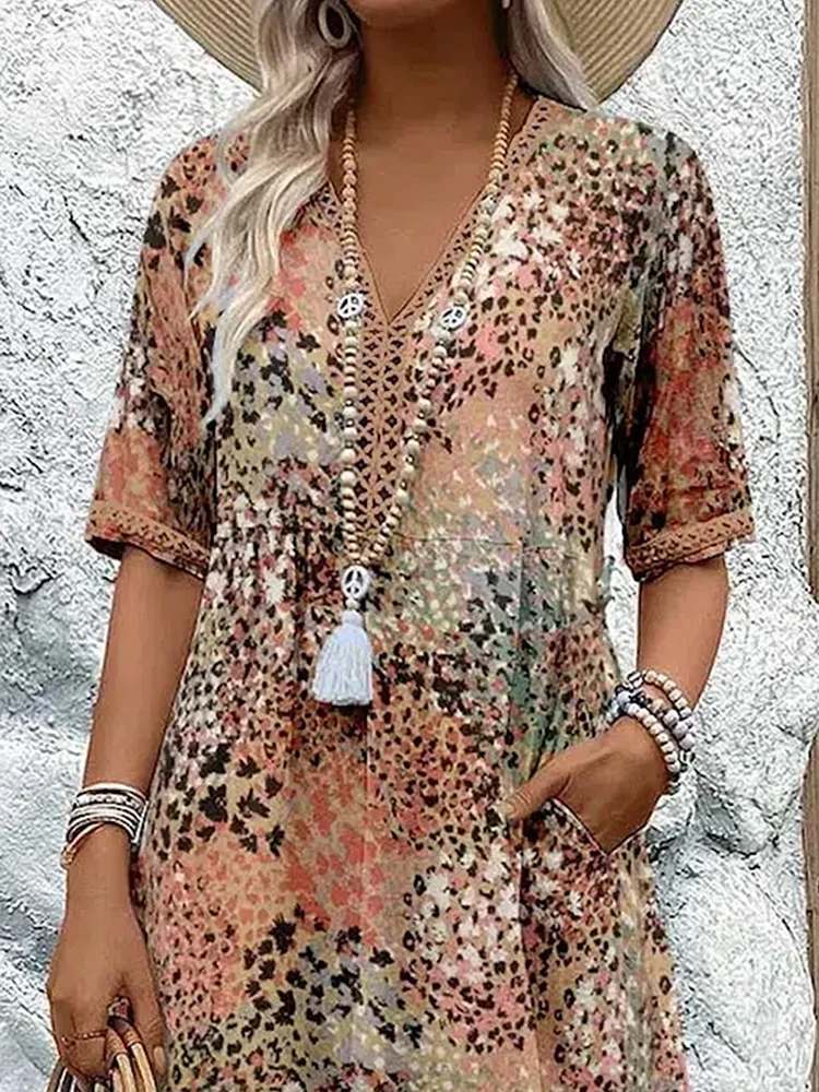 FLORENCIA | Sleeveless midi dress with vibrant print